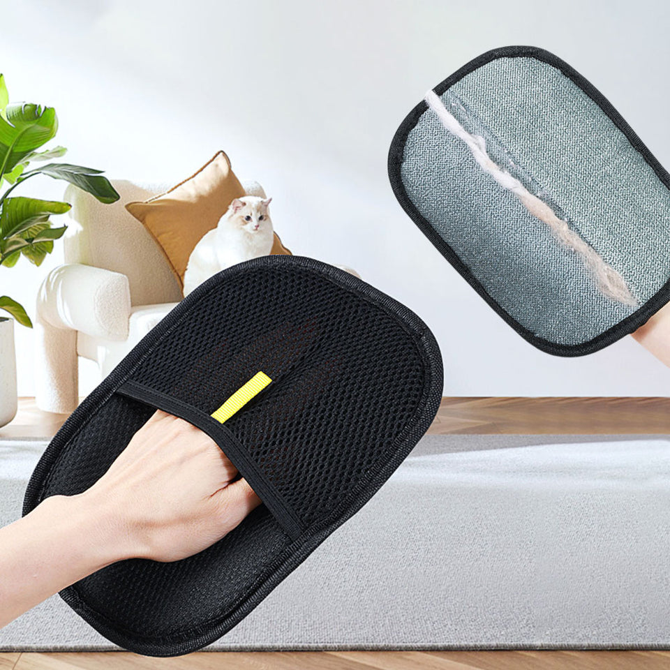 Silicone deshedding glove removing loose pet fur safely.